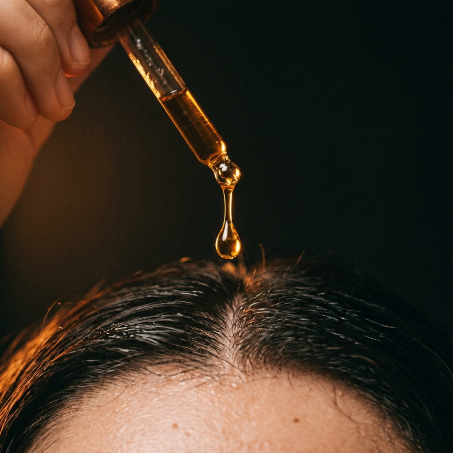 GRWTH serum being applied to scalp